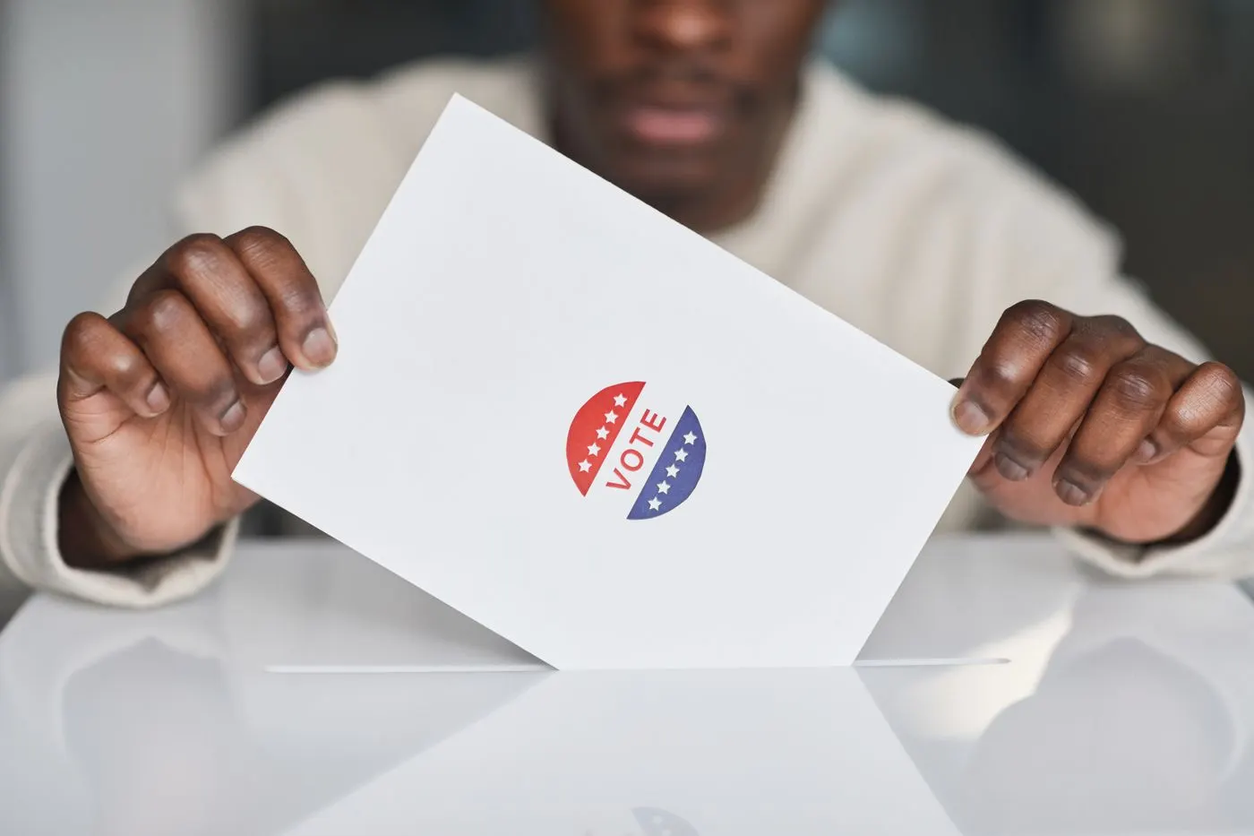 A voter casting a ballot at a polling station